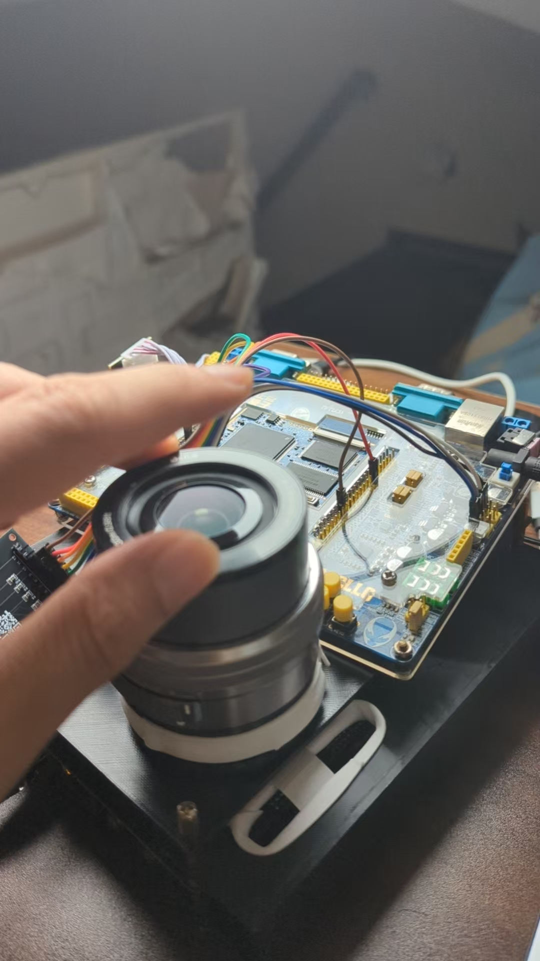 A hand placed over the lens